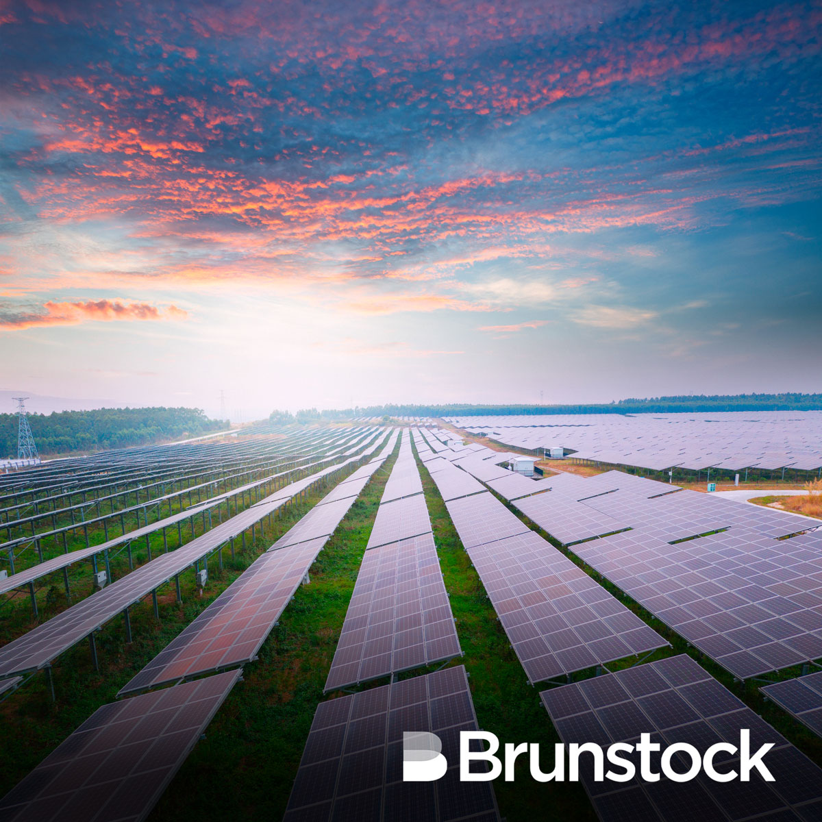 Solar farm against a pretty pink dusk sky