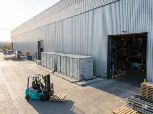 A commercial storage BESS outside a factory in Switzerland