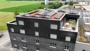 A European business with solar panels on the roof that needs C&I BESS